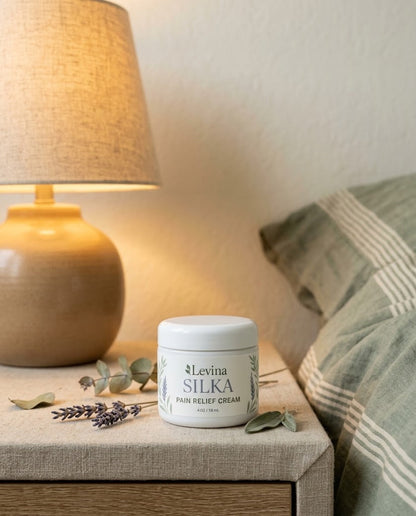 Levina Silka on a nightstand next to a warm lamp and lavender